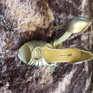 Beautiful pair of silver Manolo Blahnik shoes.